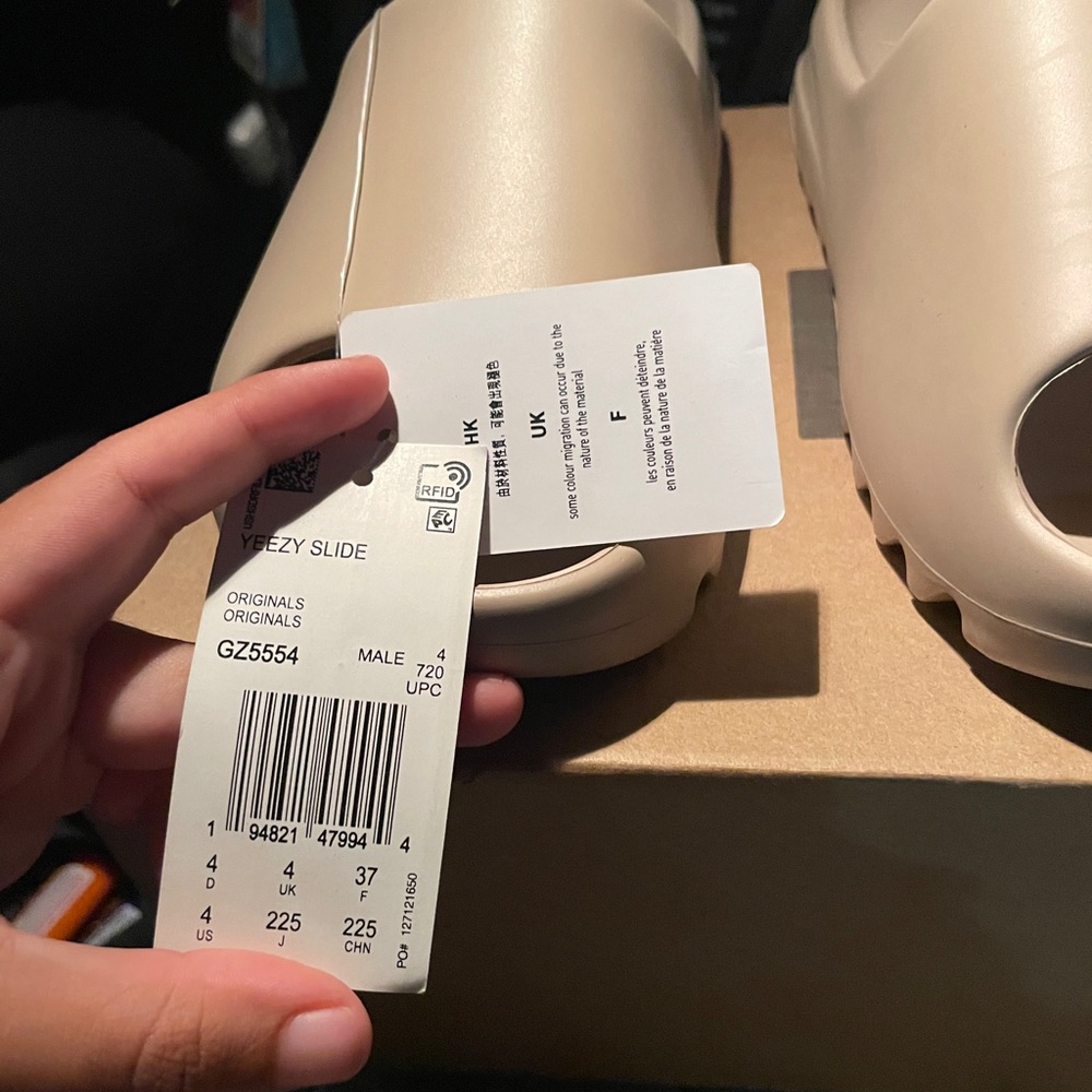 Yeezy Slides men size 4 (able to fit women)